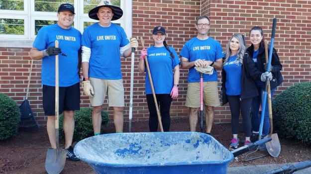 Hooker Furniture volunteers landscaping the front our Henry County Public School's Community Learning Center