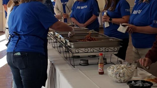 Longwood University Volunteers and UW Staff serving volunteers breakfast