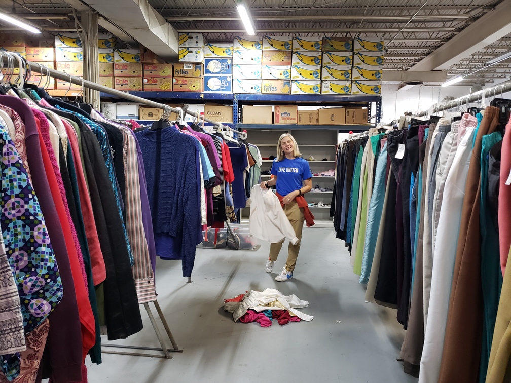 Carter Bank & Trust Volunteers assisting with clothing organization at Henry County Food Pantry's Community Clothing Closet