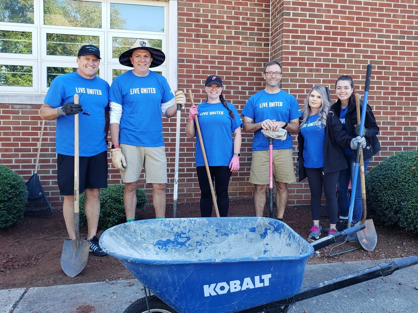 Hooker Furniture volunteers landscaping the front our Henry County Public School's Community Learning Center