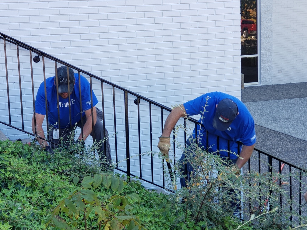 Eastman Chemical Volunteers Assisting with sprucing up the landscape at Piedmont Arts